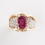 A synthetic ruby, diamond and fourteen karat gold ring