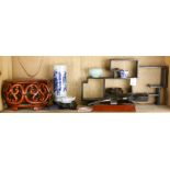 A shelf of Chinese wood stands, a table top shelf, bi discs, etc