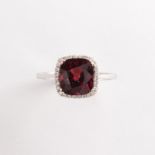 A red spinel, diamond and eighteen karat gold ring
