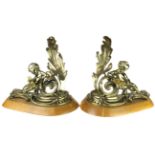 A pair of Louis XV style gilt metal chenets