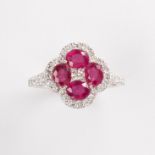 A ruby, diamond and fourteen karat white gold ring