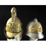 A (lot of 2) French gilt or silvered metal fireman's helmets