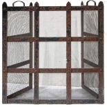 A Spanish Revival style wrought iron fireplace screen