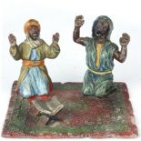An Austrian cold-painted figural sculpture of Arabs at prayer