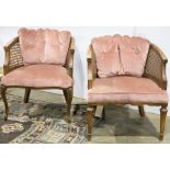 A pair of Louis XV style caned back armchairs with pink velvet slip seats