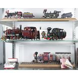 Three shelves of LGB steam engines and cars