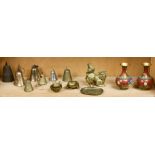 A shelf Asian bells and other metalwork