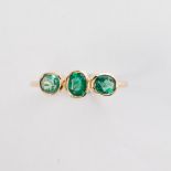A pair of emerald and fourteen karat gold stacking ring