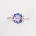 A tanzanite, diamond and fourteen karat white gold ring