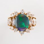 A black opal, diamond and eighteen karat gold ring