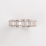 A diamond and fourteen karat white gold band ring