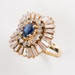 A sapphire, diamond and fourteen karat gold ring