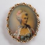 A seed pearl and fourteen karat gold portrait brooch