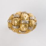 An eighteen karat gold and diamond ring