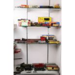 Five shelves of mainly H-O scale trains including engines