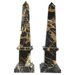 A pair of Italian black Portoro marble obelisks