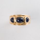 An onyx and fourteen karat gold ring