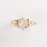 A diamond and fourteen karat gold ring