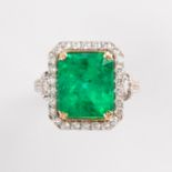 A Colombian emerald, diamond and eighteen karat gold ring