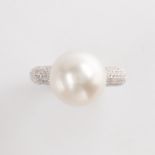A pearl, diamond and fourteen karat gold ring