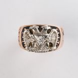 A diamond and ten karat bi-color gold ring