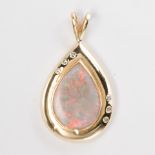 An opal and fourteen karat gold pendant