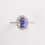 A tanzanite, diamond and fourteen karat white gold ring