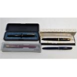 Four fountain pens including two Parker Duofold, o