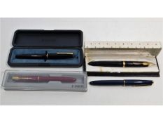 Four fountain pens including two Parker Duofold, o