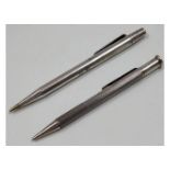 A Yard-O-Led silver pencil twinned with one other,