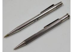 A Yard-O-Led silver pencil twinned with one other,