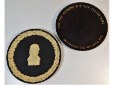 Two Wedgwood black basalt commemorative plates: Gu