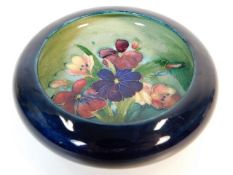 A vintage Moorcroft pottery dish with floral decor