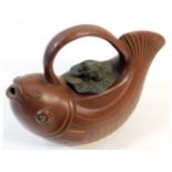 A Chinese Yixing teapot depicting carp with lily p