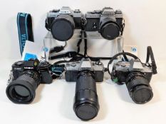 Five 35mm film cameras by Minolta: three X300 mode