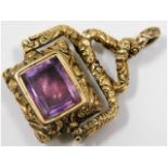 A 19thC. yellow metal watch fob set with amethyst