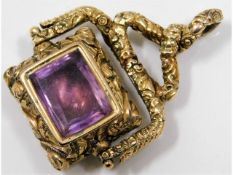 A 19thC. yellow metal watch fob set with amethyst