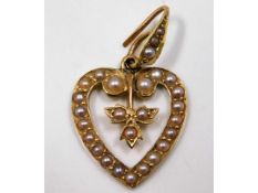 A 15ct gold pendant with seed pearl 18mm high, exc