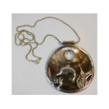 A sterling silver chain & dolphin decorated pendan
