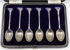 A case set of six Sheffield silver teaspoons with otter & fish decor, by James Dixon & Sons 1927, ap