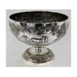 An impressive 19thC. repoussé silver monteith decorated with Asian rural scenes by Grish Chunder Dut