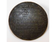 A bronze 1765 calendar token