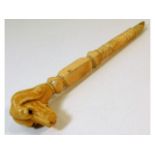 A 19thC. carved ivory parasol handle, a/f one end,