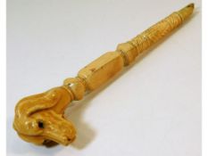 A 19thC. carved ivory parasol handle, a/f one end,