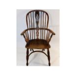 A late 18thC. elm Windsor chair with hooped crinol