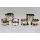 Two pairs of silver napkin rings & two inscribed s