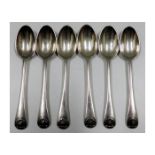 A set of six silver teaspoons with shell decor to