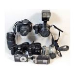 A Canon 4000D SLR digital camera with 18-55mm 75-3000 mm lens; a Panasonic FZ50 bridge camera; a Lum