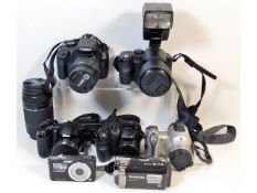 A Canon 4000D SLR digital camera with 18-55mm 75-3000 mm lens; a Panasonic FZ50 bridge camera; a Lum