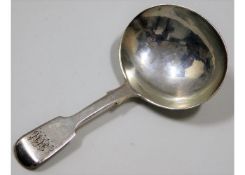 An 1842 London silver caddy spoon by Charles Lias,